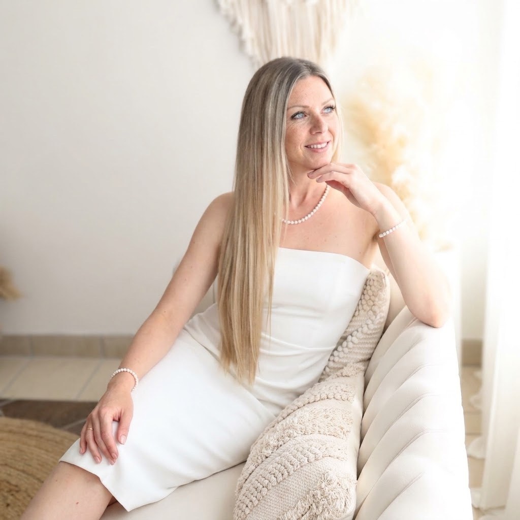 Tanja Novojevska, Executive Reset facilitator, sitting on a sofa in a bright room